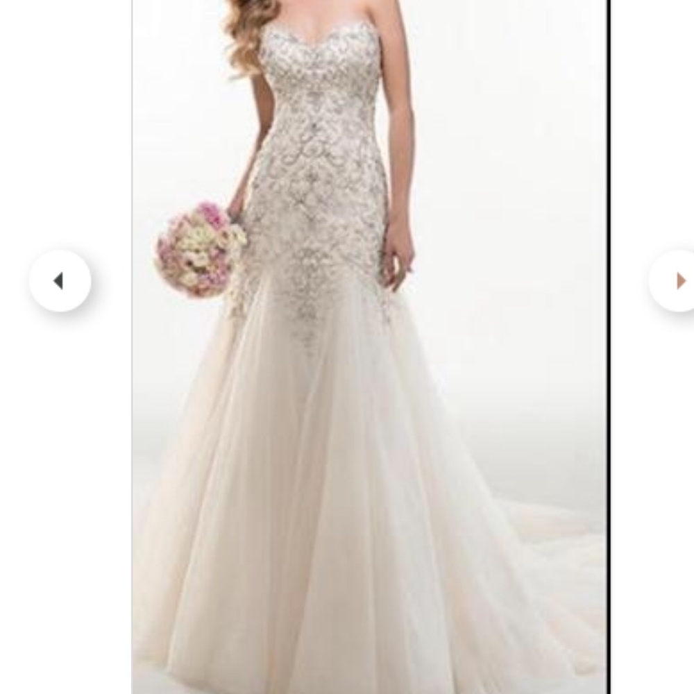 Maggie Sottero never worn/altered with tie up back! Crystal bling/ivory color!